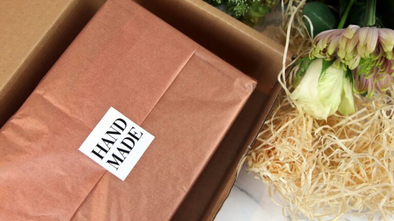 Hand Made vinyl label sealing tissue paper in a kraft gift box